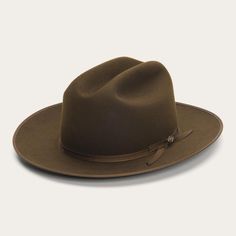 With only a handful in production, the Pure Open Road is not a hat you see in the wild very often. Built for true pioneer spirits from pure fur felt for unbeatable softness and resilience, it features a grosgrain hat band and a new 1865 hat pin for a subtle dose of texture. The hand-sewn brown roan sweatband and satin Stetson Open Road, Mens Dress Hats, Modern Cowboy, Stetson Hat, Wide Trousers, Box Packing, Thigh Boot, Open Road, Dress Hats