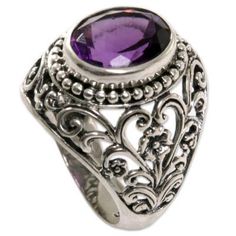 Purple charm and silver flowers meet in this elegant creation by Indonesian silversmith Ngurah Gede. This cocktail ring features a sparkling three-carat amethyst that is sure to catch eyes. The sterling silver band is beautifully crafted with floral and heart designs. Classic Silver Amethyst Ring With Gemstone Accents, Elegant Amethyst Crystal Ring With Stone Setting, Elegant Silver Amethyst Crystal Ring, Elegant Silver Amethyst Ring With Stone Setting, Silver Amethyst Rings With Stone Setting, Silver Amethyst Ring With Gemstone Accents For Anniversary, Silver Amethyst Ring With Gemstone Accents For Promise, Sterling Silver Amethyst Ring With Gemstone Accents For Anniversary, Formal Spiritual Amethyst Ring