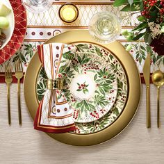 a place setting with plates, silverware and napkins