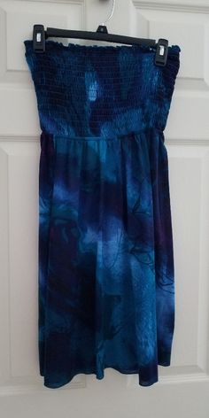 Cute Strapless Dress Or Coverup To Wear At The Beach. Top Part Is Elastic So It Stretches. There Are Two Ties In The Back. 30 Inches Top To Bottom. Colors Are Different Shades Of Blue. Only Worn Once. Still Looks Brand New. No Stains. No Fading. I'd Keep It If It Still Fit. Cute Strapless Dresses, Different Shades Of Blue, At The Beach, Shades Of Blue, Strapless Dress, The Beach, Cover Up, Shades, Elastic