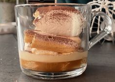 a glass mug filled with ice cream and dessert