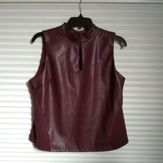 Brand: Marc New York Top. New With Tag Faux Leather Front, Soft And Stretchy Fabric Back, Soft/Stretchy & Washable. Mock Neck With Keyhole Keyhole In The Back With Button Closure Sleeveless Size-M Burgundy Color. Sleeveless Faux Leather Top For Night Out, Fitted Sleeveless Faux Leather Top, New York Top, Marc New York, Brown Flats, Burgundy Color, Leather Top, Stretchy Fabric, Mock Neck