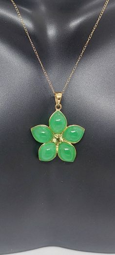 "GREEN Jade/ Peridot Flower 14k Yellow Gold Pendant 18\" Yellow Gold Chain. Jade/Peridot Flower Pendant. Flower Necklace. Flower Petal Jewelry. Petal Necklace. Green Jade Flower LOVER. Product Info: - Pendant Measures: 28x22mm - Stone: Green Jade / Peridot. - Stone Color: Green. - Metal: 14k Yellow Gold - Chain Length: 18 Inches. - Nice Gift Box Included." Green Gemstone Flower Pendant Jewelry, Green Flower Pendant Jewelry For Anniversary, Green Gemstone Flower Pendant Necklace, Green Gemstone Flower Pendant Necklaces, Fine Jewelry With Green Flower-shaped Gemstones, Fine Jewelry In Green With Flower Shape, Fine Jewelry In Flower Shape And Green Color, Fine Green Jewelry In Flower Shape, Green Flower-shaped Jewelry For Anniversary