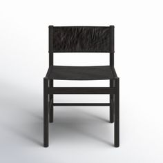 a black chair on a white background with no one in the room to see it