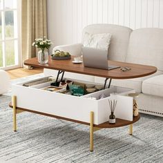 a coffee table with an open drawer underneath it on a rug in a living room