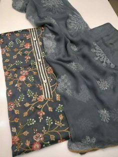 Item Overview ATHARVA Embroidery Salwar Kameez/Embroidery Jaal Black Grey w/Embroidered Dupatta/Thread Work Custom Stitch/Tunic Pant/Patiala Salwar/ Dno. CH1479 Fabric:  * Shirt Chanderi Silk - Embroidered Neck- Black Grey  - 2.5 Mts Beautiful Hand Embroidere Jaal * Dupatta: Chiffon ChinnonDupatta- 2.5 Mts- Thread work Latkans Tassels- (Motifs may wary) * Bottom Santoon Silk 2.5 Mts. Excusive Hand Embroidered Party Wear Punjabi Suit. Customization: * Fabrics Customization: Designs Can be made in Designer Cambric Set With Intricate Embroidery, Eid Traditional Wear With Floral Embroidery On Georgette, Unstitched Cambric Sets With Intricate Embroidery, Festive Cambric Sets With Intricate Embroidery, Unstitched Embroidered Cambric Fabric, Embroidered Georgette Kurta For Eid, Floral Embroidered Georgette Churidar For Eid, Eid Salwar Kameez With Floral Embroidery In Georgette, Intricate Embroidered Georgette Kurta