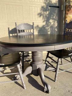 the table and chairs are all painted in different shades of gray, black or white