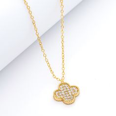 18K Gold Clad Pave Clover Necklace. Cable chain and lobster clasp closure. Measures: Chain 16" + 2" extender, pendant .5"