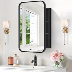 a bathroom with a sink, mirror and flowers