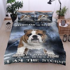 a bulldog on a bed with the words, i am the storm printed on it