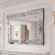 a mirror that is on the wall above a fireplace