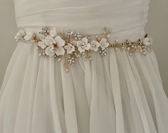 Elegant Bridal Belt With Flower Decoration, Elegant Bridal Belt With Flower Decoration For Wedding, White Embellished Sashes For Wedding, Elegant Bridal Belt With Handmade Flowers For Weddings, Delicate Floral Bridal Accessories For Wedding, Handmade White Bridal Accessories With Flowers, Elegant Bridal Belt With Handmade Flowers, White Bridal Accessories With Sashes, Bridal Belts And Sashes