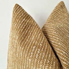 a brown and white pillow sitting on top of a table