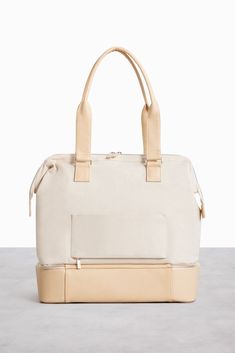 Béis 'The Mini Weekender' In Beige - Small Beige Weekender Bag & Travel Duffle Bag Modern Weekender Bag With Leather Handles For On-the-go, Beige Rectangular Weekender Bag For On-the-go, Modern Gym Bag With Luggage Sleeve For On-the-go, Practical Rectangular Weekender Bag For On-the-go, Functional Weekend Bags With Zipper Closure, Functional On-the-go Diaper Bag With Luggage Sleeve, Functional Zipper Closure Weekend Bags, Functional Diaper Bag With Luggage Sleeve, Beige Laptop Bag For Travel