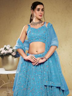 Make a stunning statement on any special occasion with our lovely sky-blue embroidered georgette engagement wear lehenga choli. This exquisite ensemble is crafted from high-quality georgette material in a beautiful sky-blue color. Designed with intricate sequin and embroidered work, this lehenga choli set is sure to turn heads and make a lasting impression.
One of the key benefits of this stunning lehenga choli is its versatility. Whether you're attending a wedding, ceremony, or reception, this Blue Georgette Lehenga With Intricate Embroidery, Light Blue Georgette Party Set, Blue Embroidered Lehenga In Georgette, Blue Embroidered Georgette Lehenga, Embroidered Blue Georgette Lehenga, Light Blue Party Georgette Set, Party Light Blue Georgette Sets, Turquoise Georgette Dupatta For Wedding, Turquoise Georgette Wedding Dupatta