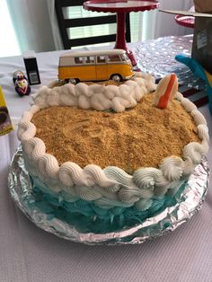 there is a cake on the table with a bus in it