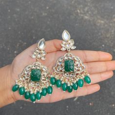 The Emerald Krishanya Earrings are unique, and lightweight chandbalis with Kundan and Gold-Plating on beautiful beaded crystals. Specifications Materials used: Kundan, beaded crystals, Gold Plating Weight: 19 g Height: 3.5 inches At Romikas, we pride ourselves on the craftsmanship and high quality of our jewelry, designed to enhance your natural beauty. Please contact us with any questions. Temple Jewelry Beaded Earrings For Parties, Festive Stone Work Beaded Earrings, Temple Jewelry Chandbali Beaded Earrings, Temple Jewelry Beaded Earrings For Festivals, Festive Beaded Dangle Earrings, Silver Jeweled Chandbali Chandelier Earrings, Chandbali Beaded Danglers For Festivals, Beaded Chandbali Earrings For Celebration, Beaded Chandbali Danglers For Festivals