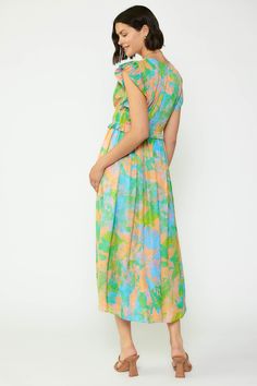 This dress is so striking—first of all, that abstract floral print is an absolute showstopper with its rainbow effect. But it doesn't stop there. Cut from lightweight jacquard featuring a subtle jacquard texture, the dress has tons of tiny pleats at the bodice, dainty ties, and fluttery pleated sleeves, all before flowing to a shin-skimming length. •V-neckline •Pleated bodice •Short sleeves •Tie detailing at front •Elasticized waist •Original 'Floral Abstraction' print, designed by Current Air D Casual Abstract Print Midi Dress For Spring, Casual Spring Midi Dress With Abstract Print, Green Abstract Print Spring Dress, Spring Multicolor Abstract Print Maxi Dress, Green Abstract Print Summer Dress, Green Summer Dress With Abstract Print, Summer Green Dress With Abstract Print, Vibrant Green Midi Dress For Spring, Vibrant Fitted Green Maxi Dress