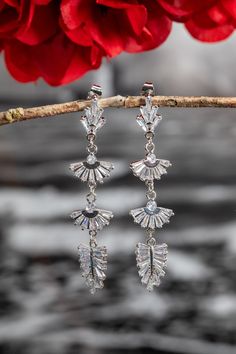 Earrings for your special occasion with crystals and small cubic zirconias inside the leaves for sparkle. Be irresistible on your special day.  If you want to change the colors of the pendant or change the design to your liking, just contact me and together we will create a masterpiece WITH YOUR HANDS. Follow the link below to see more jewelry for your special day. https://niceolhajewelry.etsy.com ◆ Delivery ◆America takes 5-9 days after shipping. ◆All items on my website are in stock. Order pro Glamorous Crystal Drop Earrings With Plating, Glamorous Plated Crystal Drop Earrings, Glamorous Cubic Zirconia Linear Earrings For Parties, Party Earrings With Cubic Zirconia Plating, Glamorous Silver Dangle Cluster Earrings, Glamorous Sterling Silver Crystal Earrings, Glamorous Crystal Earrings With Plating, Elegant Evening Crystal Earrings With Plating, Glamorous Silver Crystal Linear Earrings