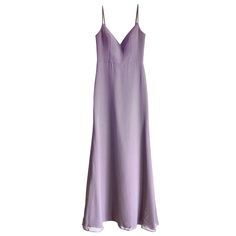 a purple dress hanging on a hanger