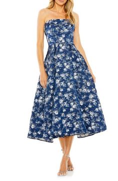 Serve up showstopping flair in this floral-brocade midi dress with a strapless silhouette and a flared skirt. 48 1/2" length Hidden back-zip closure Strapless Lined 100% polyester Spot clean Imported Asian Owned/Founded Floral Print A-line Midi Dress For Gala, Evening Midi Dress With Floral Print In Tea Length, Floral Print Midi Dress For Gala, Evening Floral Print Fit And Flare Midi Dress, Floral Print Fit And Flare Midi Dress For Evening, Floral Print Fit And Flare Midi Dress For Cocktail, Evening A-line Midi Dress With Floral Print, Strapless Floral Print Midi Dress For Evening, Blue A-line Strapless Dress For Evening