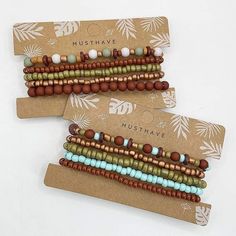 three bracelets with beads are sitting on top of a cardboard card that says must have