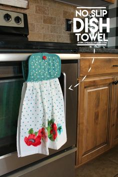 the dish towel is hanging on the oven door