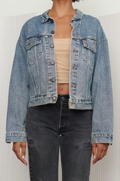 A perfect classic cropped Levi’s denim jacket in a cool blue medium wash that adds an edgy feel to any outfit. Style is slightly boxier and shorter than the original Levi’s denim jackets. Features button closure and chest and side pockets. Listed size Small. - Shoulders: 23.5” - Chest: 24” - Length: 23” - Sleeve: 22” Cropped Light Wash Denim Jacket, Cropped Medium Wash Denim Jacket, Cropped Denim Jacket With Button Closure, Medium Wash Denim Cropped Jacket For Streetwear, Washed Cropped Denim Jacket, Medium Wash Cropped Denim Outerwear, Cropped Medium Wash Denim Outerwear, Casual Washed Cropped Denim Jacket, Medium Wash Cropped Jacket For Streetwear In Spring