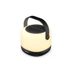 a black and white speaker with a light on it's headphones attached to the side