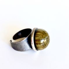 Marine inspiration, this ring is made with a real sea urchin and deep blue resin in a brass base ring, antique silver finish.  Unique model!  My work features brilliant colors and resin. Resin results in a durable piece that has a natural shine and is resistant to scratches.  I handmade each piece in my studio in Barcelona and no two are alike. This jewelry is handmade and slight differences are part of the character of the piece.  I will send the order packed in a nice craft box, ready to gift! Nickel-free Nature-inspired Round Rings, Nature-inspired Nickel Free Round Rings, Nature-inspired Nickel-free Rings, Nature-inspired Nickel Free Rings, Unique Adjustable Rings With Round Stone, Unique Adjustable Ring With Round Stone, Unique Rings For Jewelry Making, Modern Green Round Dome Ring, Unique Green Nickel-free Rings