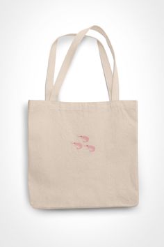 Shrimp Prawn Embroidered Tote bag 🦐✨ Shrimps or prawns are seen as simple animals but they have shown that they have memories and protect loved ones. These wonderful underdogs are pretty in pink. 🦐 100% Combed Organic Cotton As the bag is organic cotton, it might be slightly different colour to the photo. 100% vegan. 🦐💕 Beige Shoulder Bag With Embroidered Logo And Double Handle, Beige Tote Bag With Embroidered Logo, Beige Bags With Embroidered Logo For Daily Use, Embroidered Beige Tote Bag, Beige Embroidered Tote Bag, Pink Bags With Embroidered Logo For Daily Use, Pink Embroidered Shoulder Bag For Shopping, Embroidered Double Handle Bag For Everyday Use, Pink Embroidered Bags For Everyday Use