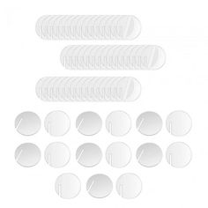 a set of white buttons and pins on a white background