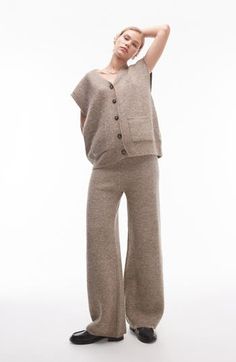 Get extra cozy for the cooler seasons in these wool-kissed sweater-knit pants cast in a calming, earthy hue. 33" inseam; 23" leg opening; 12" front rise; 14" back rise (size Medium) Elastic waist 64% polyester, 14% acrylic, 14% nylon, 5% wool, 3% elastane Hand wash, dry flat Imported Casual Wool Pants For Loungewear, Cozy Beige Knit Pants, Fall Wide Leg Pants With Soft Texture, Brown Wool Pants For Winter, Cozy Wide Leg Knit Pants, Cozy Knit Pants With Relaxed Fit, Cozy Knit Relaxed Fit Pants, Cozy Knit Wide Leg Pants, Cozy Knit Wide-leg Pants