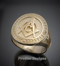 Made entirely in the U.S.A. Ring Details~ Bold - Handsome - Exquisitely Finished - Original The newest addition to our Prestige Collection, this gold version of our moral compass ring is sure to stand out. The top prominently features the square and compass with the four directions around the outer edge. The side windows display the symbolic trowel and level on a textured background. Hand finished to perfection, the high polish creates a contrast against the sandblasted background. All creations Classic Gold Initial Ring Collectible, Classic Yellow Gold Engraved Ring With Maker's Mark, Classic Engraved Yellow Gold Ring With Maker's Mark, Classic Polished Collectible Jewelry, Timeless Gold Engraved Ring, Luxury Anniversary Signet Ring With Maker's Mark, Gold Signet Ring With Maker's Mark, Gold Round Signet Ring With Maker's Mark, 14k Gold Timeless Signet Ring For Collectible