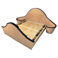 a wooden bed with two drawers on each side and one drawer open to show the mattress