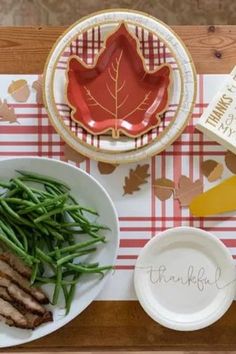 a table topped with plates and bowls filled with food