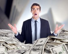 a man in a suit and tie is surrounded by stacks of money with his hands wide open