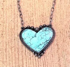 This finely-crafted Vintage Turquoise Heart Necklace features a beautiful turquoise centerpiece, making it the perfect accessory for any occasions. Its timeless design ensures that it will never go out of style. Turquoise Heart Charm Pendant Necklace, Turquoise Pendant Necklace With Heart Charm, Bohemian Blue Heart Pendant Jewelry, Blue Bohemian Heart Pendant Jewelry, Elegant Turquoise Heart Beads Jewelry, Elegant Turquoise Jewelry With Heart Beads, Turquoise Heart-shaped Necklaces For Gifts, Turquoise Heart Necklaces For Gift, Turquoise Heart-shaped Necklace For Gift