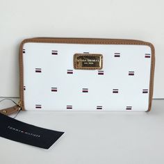 New With Tags Faux Brushed Leather Color: White Interior: Navy 8 Card Slots 2 Cash Slots Inside Zip Pocket Zip Around Measures: 8" X"4" X 1" Tommy Hilfiger Wallet, Tommy Hilfiger Bags, Red Wallet, Wallet Organization, Black Wallet, Handbag Wallet, Zip Wallet, Tommy Hilfiger Women, White Interior