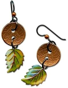 two earrings with leaves hanging from them