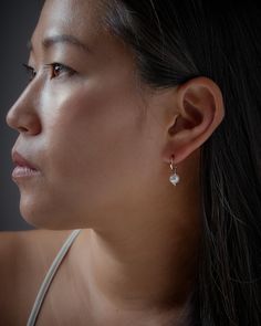 "These pearl hoop earrings feature a beautiful pearl on an open hoop. Our dainty hoop earrings are meant to be classic enough for everyday wear or to give as a bridesmaid gift. These natural pearl earrings will be a favorite of yours! SOLD AS A PAIR ** PLEASE NOTE: The model is wearing multiple earrings. This listing is for a pair of Mini Pearl Hoops Earrings only ** At LunaiJewelry, we take pride in the details and love we pour into everything we make. We know you'll find something lovely for y Pearl Drop Dangle Huggie Earrings, Pearl Hoop Huggie Earrings, Elegant Pearl Huggie Dangle Earrings, Everyday Teardrop Earrings With Pearl Charm, Modern Pearl Charm Earrings For Everyday, Classic Huggie Pearl Earrings, Modern Everyday Earrings With Pearl Charm, Elegant Everyday Huggie Earrings With Pearl Charm, Elegant Everyday Pearl Huggie Earrings