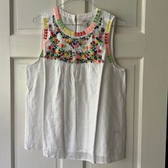 J Crew Embroidered Sleeveless Top White Embroidered Tank Top For Spring, White Sleeveless Blouse Tank Top For Spring, Spring White Tank Top With Floral Embroidery, White Floral Embroidery Tank Top For Spring, Casual White Tank Top With Floral Embroidery, White Floral Embroidered Tank Top For Vacation, White Embroidered Cotton Tank Top, Sleeveless Spring Embroidered Top With Floral Embroidery, Multicolor Sleeveless Embroidered Top For Spring