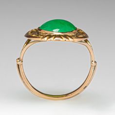 This awesome vintage ring features engraved floral details and contains one (1) oval cabochon cut natural jadeite jade set into a bezel. The ring measures 19.8mm at the top, rises 3.5mm above the finger, tapering to 1.2mm wide and 1.1mm thick at the base of the shank. This ring is currently a size 2.5 and can be sized up. Formal Oval Jade Emerald Ring, Elegant Oval Chrysoprase Rings, Antique Emerald Ring Oval Cabochon, Antique Emerald Ring With Oval Cabochon, Vintage Oval Cabochon Ring With Bezel Setting, Vintage Oval Signet Ring With Bezel Setting, Antique Engraved Oval Emerald Ring, Antique Oval Engraved Emerald Ring, Elegant Oval Cabochon Emerald Collectible Ring