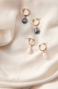 "Find SET & STONES Adelle Keshi Pearl Hoop Earrings on Editorialist. Keshi pearls dangling from high-shine hoops make a chic, modern accessory that goes with almost anything. 1 1/4\" drop; 3/8\" width Pearl size: 9mm Snap-post closure Due to natural variation, pearl shape and size may vary slightly 14k-gold fill/freshwater keshi pearl Made in the USA" Unique Pearl Earrings, Gold Peacock, Peacock Pearls, Freshwater Pearl Jewelry, Modern Accessories, Hoop Earring Sets, Pearl Hoop Earrings, Keshi Pearls, Jewelry Photography