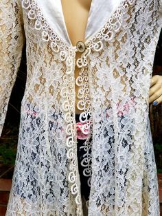 "Long LACE Cardigan in very nice condition. Tag LABEL SAM USA Small medium Measurements Shoulder to shoulder back 16\" Underarm to underarm back 21\" Measurement at button closure 18\" taken flat at front Approximately 34-35\" Shoulder to hem 35\" plus tassel. Thanks for browsing through our shop, have an awesome day" Fitted White Outerwear For Festival, Fitted Long Cardigan For Festivals, Vintage Fitted Summer Cardigan, Fitted Vintage Summer Cardigan, Fitted Vintage Outerwear For Festival, Fitted Long Sleeve Cardigan For Festival, Vintage Fall Festival Cardigan, Fitted Vintage Cardigan For Spring, Long Lace Cardigan