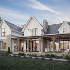 this is an artist's rendering of a modern farmhouse style home in the country