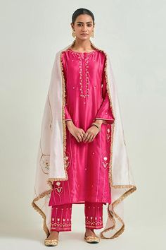 Fuchsia straight kurta with heavy floral pattern embroidery. Comes with embroidered hem pant and light pink embroidered dupatta.
Components: 3
Pattern: Embroidered
Type Of Work: Sequins, Cutdana and Gota Lace, Floral Patterns
Neckline: Round
Sleeve Type: Three Quarter
Fabric: Silk Chanderi
Color: Fuchsia
Other Details: 
Elasticated pant waistband
Fringed hem dupatta
Closure: Kurta: Front placket
Occasion: Puja - Aza Fashions Pant Saree, Kurta Pant Set, Embroidered Hem, Set Saree, Embroidered Dupatta, Straight Kurta, Color Fuchsia, Sharara Set, Salwar Kameez Designs