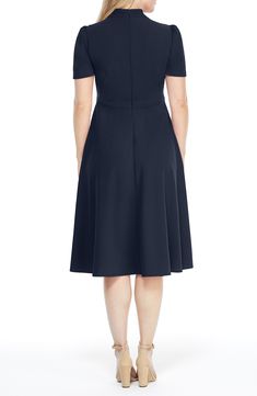 This dainty short sleeve dress is a retro inspired staple that's perfect for any well-dressed occasion. 45" length Necktie Short sleeves Back zip closure Lined 96% polyester, 4% spandex Hand wash, dry flat Imported Model Stats: 5'10" height; 34" bust; 27" waist; 35" hips. Elegant Cap Sleeve Dress With Back Zipper, Fitted Dress With Back Zipper And Short Sleeves, Classic Short Sleeve Midi Dress, Classic Fit And Flare Knee-length Midi Dress, Classic Knee-length Dress With Back Zipper, Formal Short Sleeve Midi Dress With Flattering Silhouette, Formal Midi Dress With Flattering Silhouette And Short Sleeves, Classic Fitted Dress With Cap Sleeves, Short Sleeve Fit And Flare Midi Dress For Work