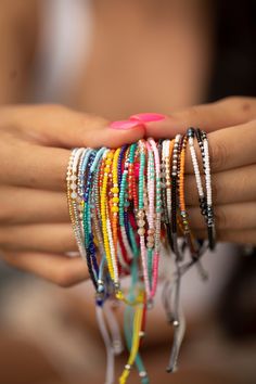 These bracelets are so cute and colorful, sure to give a pop of color to any look. They give a boho vibe and look great dressed up or down. Stack or wear alone. We have so many cute styles, and they makes the perfect gift! Details:       12 styles     Each stack comes with 3 rows of beads     Size is adjustable (7" - 9")     Materials:     Nylon with beads Bohemian Multicolor Wrap Bracelet For Party, Summer Bracelets With Tiny Beads, Bohemian Beaded Stretch Bracelet For Everyday, Trendy Beaded Bracelets For Summer Festivals, Bohemian Wrap Bracelet With Colorful Beads For Party, Bohemian Summer Beaded Bracelets With Colorful Beads, Trendy Summer Festival Beaded Bracelets, Bohemian Summer Jewelry With Letter Beads, Summer Festival Bracelets