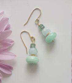 These are very feminine Bar Earrings with Crysoprase (10 mm) Aquamarine (6 mm) and Green Apatite faceted beads (3.5-4 mm) with disk spacer beads made of 925 Solid Sterling Silver plated 24K Gold (Vermeil). All metal components are Vermeil. These earrings are 3-3.5 centimeters long. Milky Aquamarine Faceted Roundelle beads: 7-8 mm, Grade AAA Chrysoprase Smooth Roundelle beads: 11-12 mm, Africa, Grade AA Green Apatite faceted beads: 3.5-4.5 mm, Grade AAA Designed and Made by AnGjewelry! They will be delivered in a cute gift box! ♡ Aquamarine is the birthstone for March. Handmade Gold Earrings With Chalcedony, Elegant Nickel-free Chrysoprase Jewelry, Round Chrysoprase Earrings Gift, Handmade Elegant Chrysoprase Earrings, Gold Chrysoprase Earrings For Gift, Gold Chrysoprase Earrings As A Gift, Elegant Handmade Chrysoprase Earrings, Gold Chrysoprase Gemstone Earrings, Elegant Amazonite Earrings As A Gift